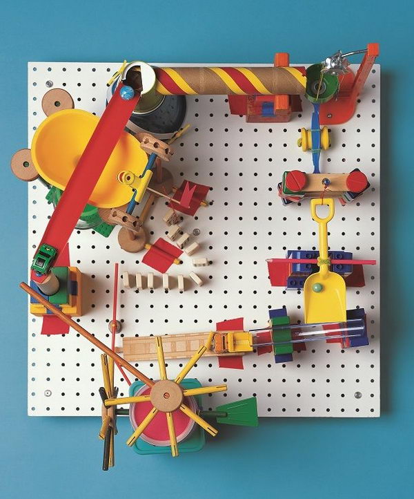 DIY Marble Run Craft, This peg board marble run involves creating a clacking, whacking gumball machine that runs without electricity, all with parts found in the kitchen and toy box. A complete operation tutorial was provided. 