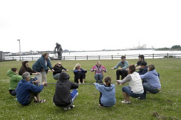 Trust Circle Team Building Activities. The group must stand in a circle holding a rope or holding hands. People taking turns to lean in and out of the circle to test the trust and support of others. 