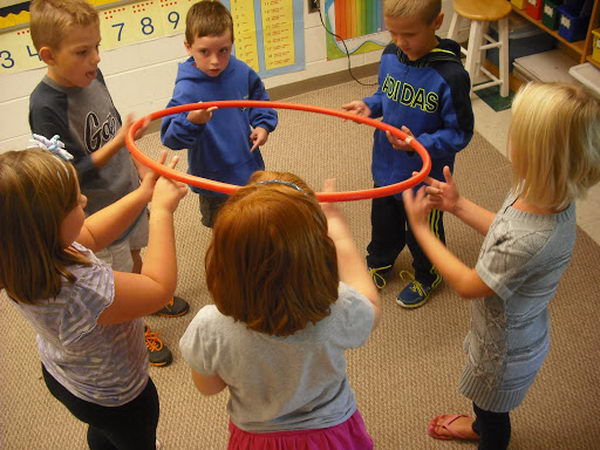 Hula Hoop Team Building Activity. They had to move the hula hoop around in a circle until the marker was back where it started. 
