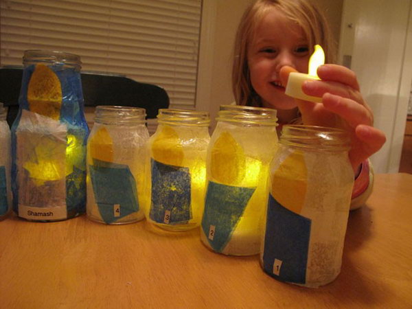 Make a tot friendly menorah with recycled glass jars and LED tea lights. 