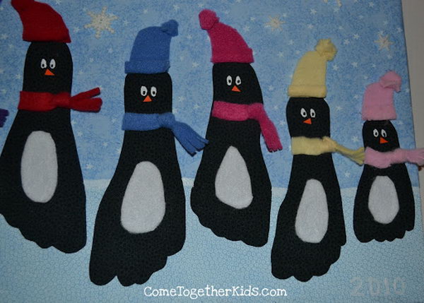 These penguin wall hangings is a really cute way to use footprints to create some winter art, 