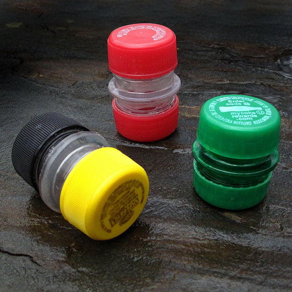 A small, lightweight reusable container made out of the necks and lids of two plastic soda bottles. 