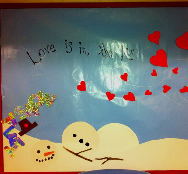 Love is in the Air: This bulletin board shows winter melting away and 'let it snow' tumbling down. Hearts for Valentines day are being 'blown in'. 