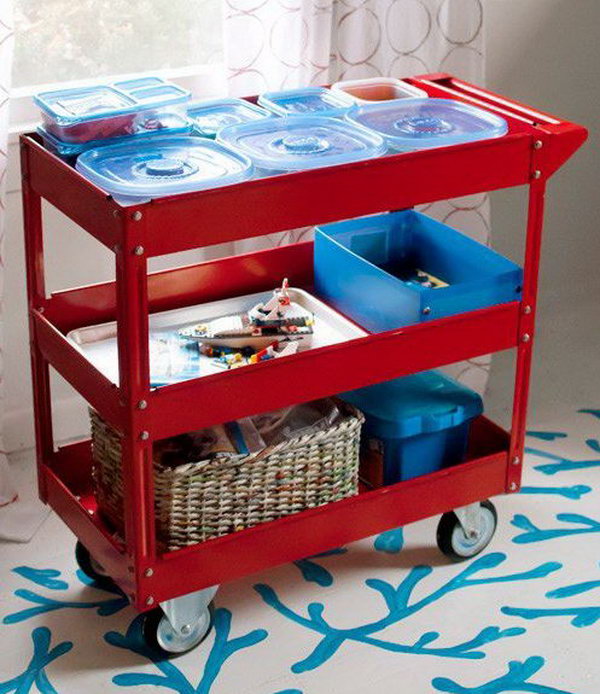 Use a three shelf steel service cart to store the Lego sets and characters as well as projects in progress. Kids are free to work on the dining room table, the kitchen table, the coffee table — wherever the family is congregating. 