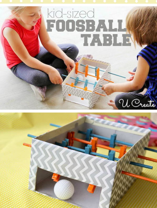 DIY Mini foosball table made with shoebox, clothespins and small wooden dowels. 