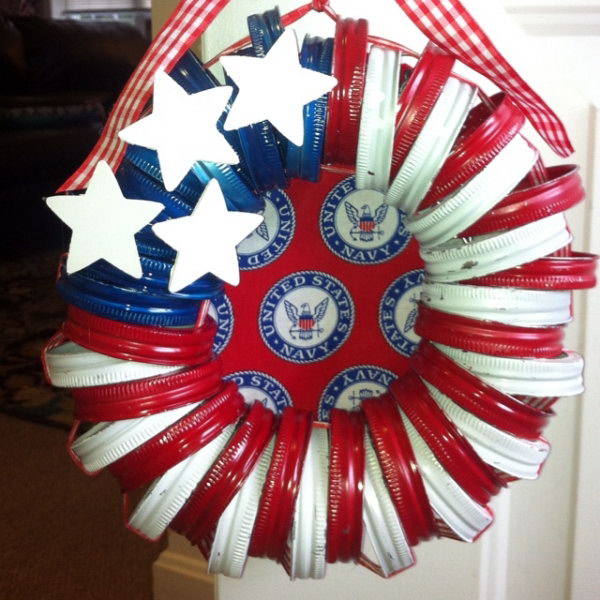 Patriotic Mason Jar Lid Wreath. Take leftover mason jar lids, paint them in red white and blue, wrap them in rope and create adorable wreath ornaments. Super easy and quick  perfect for kids and fun to embellish. 