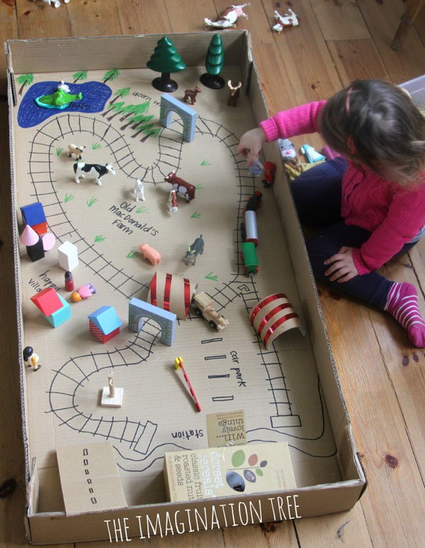 Train Tracks Small World in a Cardboard Box. Perfect rainy afternoon fun pretend play set up which encourages creativity and imagination. 