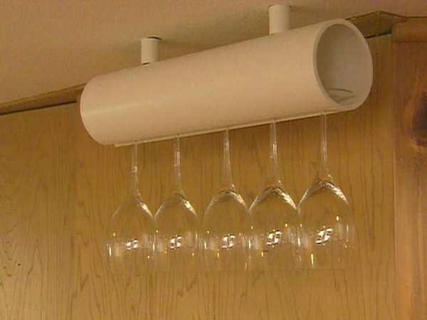 PVC Wine Glass Holder. Cut a channel in the PVC pipe, then hang it upside down. A great kitchen storage idea. 