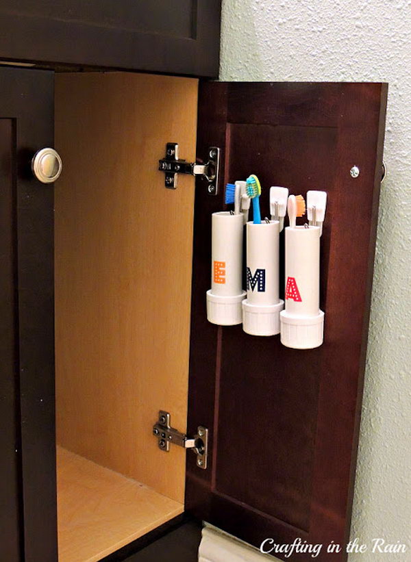 PVC Pipe Toothbrush Holder. Hidden away on the inside of the cupboard door they are easily accessible and removable. Great for space saving and for kids who may not be able to reach the back of a counter. 