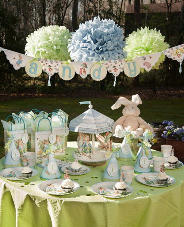 What a cute theme for a first birthday party! I especially love the big handmade paper balls hanging up as an awesome backdrop. 