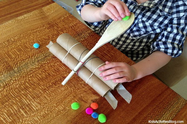 Wooden Spoon Catapult. Most kids love this catapult very much with a huge hit. It is enjoyable to watch the pom poms flying across the table. Parents and kids can PK to see who can launch their pom poms the furthest. Learn how to do it. 