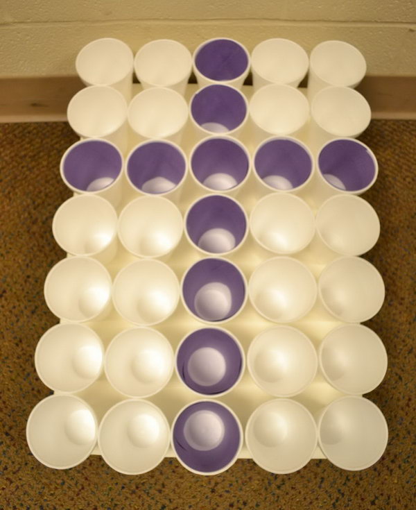 Cross Toss. Prepare all the cups in a tray and insert the rolled purple paper to make a cross. Throw all the purple Easter eggs in the purple cups. The kids will surely have fun and they can also improve their shooting accuracy. 