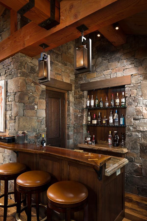 Rustic home bar design. The home bar has become one of the typical rooms in homes today. Rich wood, leather chairs,stone wall are popular in the modern day life. 