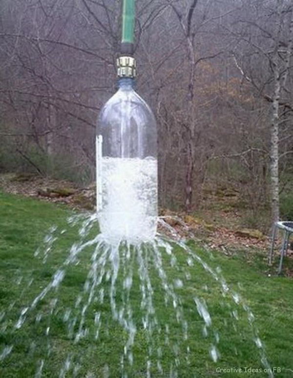 Homemade Sprinkle. Attach the holes poked soda bottle  to garden hose. Hang it over the tree branch and the kids can cool off with the water sprinkle on dog days. 