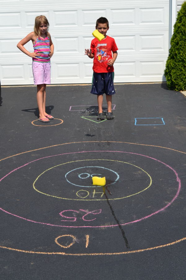 Sponge Bullseye. Draw a bullseye and assign score for each circle of the target. The kids toss their sponge at the starting line. It's great to train your kids' throwing accuracy in this funny way in summer. 