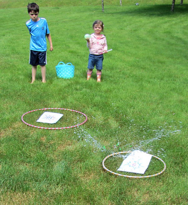 Water Balloon Math Game. It's a good way to have fun and learn math. Make the targets with hoops and place numbers inside. Mark the water balloon with equations equal the numbers on the target. Get ready and toss at the target. 